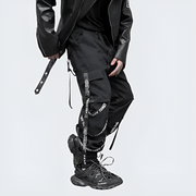 Right side man wearing black techwear cargo pants adjustable straps