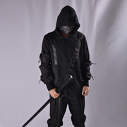 Man wearing black techwear hoodie multiple pockets decoration