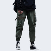 Man wearing army green baggy techwear pants front view