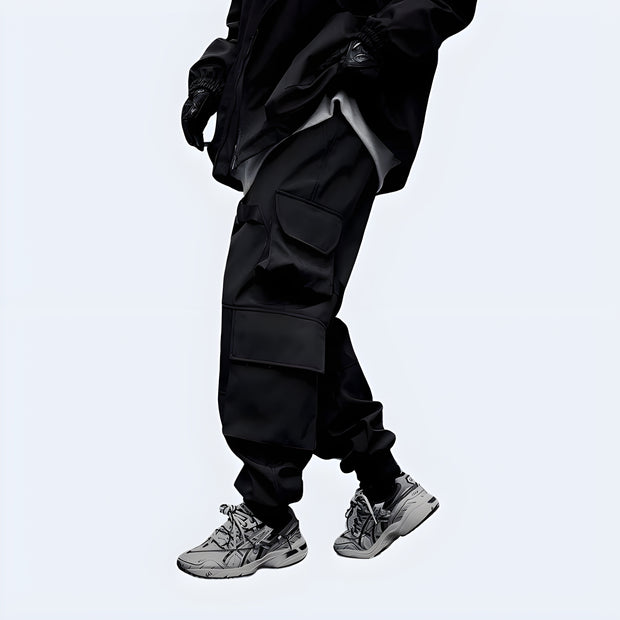 Man wearing black big pocket techwear baggy pants elastic waist