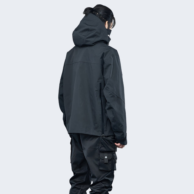 Man wearing black catsstac techwear hoodie adjustable hood