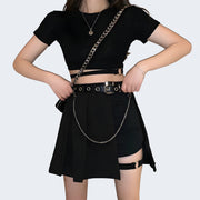 Women wearing black pleated style skirt with belt