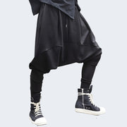 Man wearing black ninja jogger pants elastic