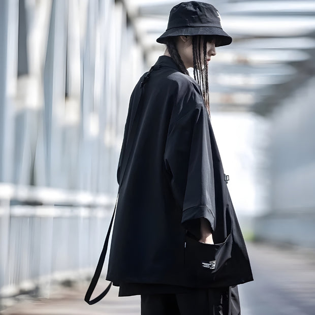 Man wearing black noragi jacket multiple pockets