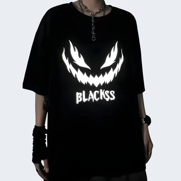 Man wearing black reflective T-shirt round-neck