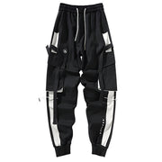 Unisex wearing black strap cargo pants elastic waistband