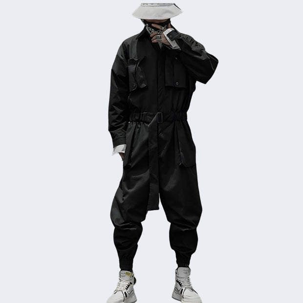 Man wearing black Techwear jumpsuit multiple pockets
