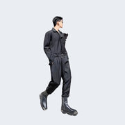 Man wearing black techwear overall versatile