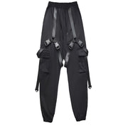 Unisex wearing black techwear buckle cargo pants elastic waist