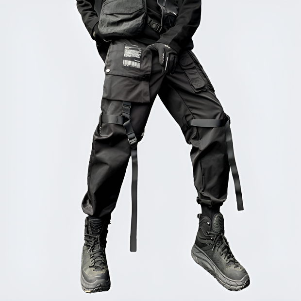 Man wearing black paratrooper cargo pants multiple pockets on both sides