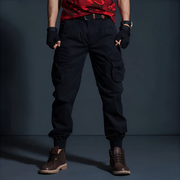 Man wearing black airborne cargo pants multiple pockets on both sides