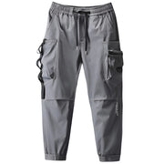 Unisex wearing grey techwear pants drawstring closure