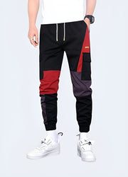 Unisex wearing red techwear pants adjustable straps