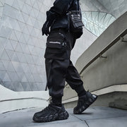 Man wearing black bybb's multi pocket pants elastic waist 