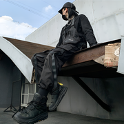 Left view man wearing black paratrooper cargo pants on drawstring closure