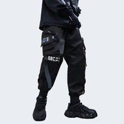 Man wearing black bybb's multi pocket pants adjustable straps