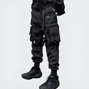 Man wearing black airborne techwear joggers leg panels