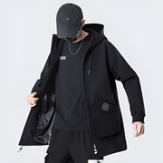 Man wearing black cape hoodie zipper closure