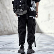 Man wearing cargo pants with straps large pockets of both sides