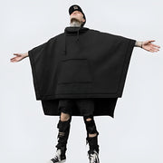 Man wearing black hooded poncho sweater big pocket on the front