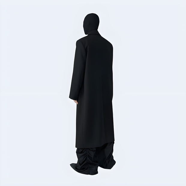 Man wearing black long techwear coat turn-down collar style