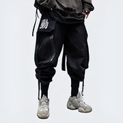 Man wearing black samurai pants elastic waistband