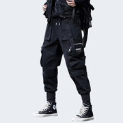Man wearing black streetwear skinny sweatpants side hand pocket