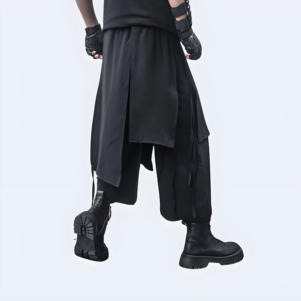 Man wearing black Techwear harem pants, back view, sleek and modern streetwear from Techwear UK