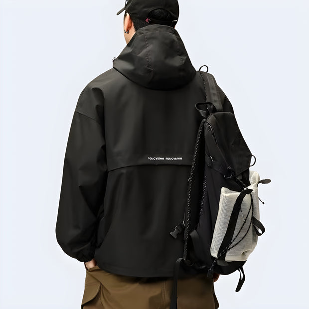 Man wearing black techwear hoodie double layered decoration