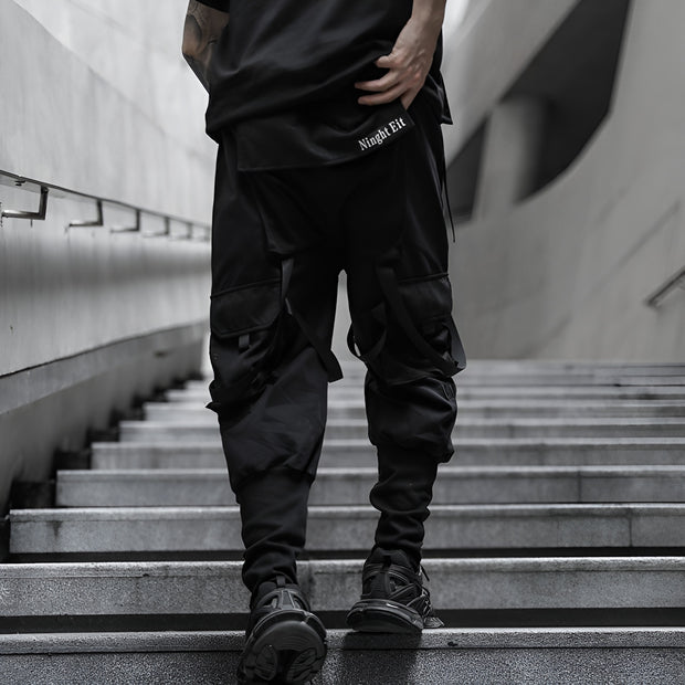 Man wearing black techwear pants back view