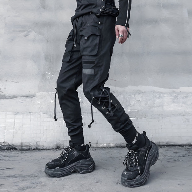 Unisex wearing black skinny techwear pants