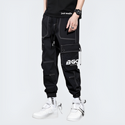 Man wearing black cyberpunk pants multiple pockets