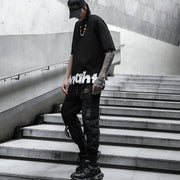 Man wearing black tactical cargo pants front view