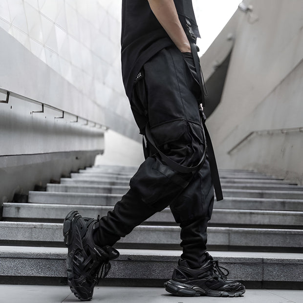 Man wearing black techwear pants side view with multiple pockets
