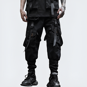Man wearing limited edition black techwear pants with straps