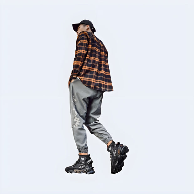 Men’s black Harajuku-style techwear shoes – sleek streetwear sneakers with chunky sole and futuristic detailing, Techwear UK collection.