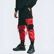 Unisex wearing red techwear pants adjustable straps