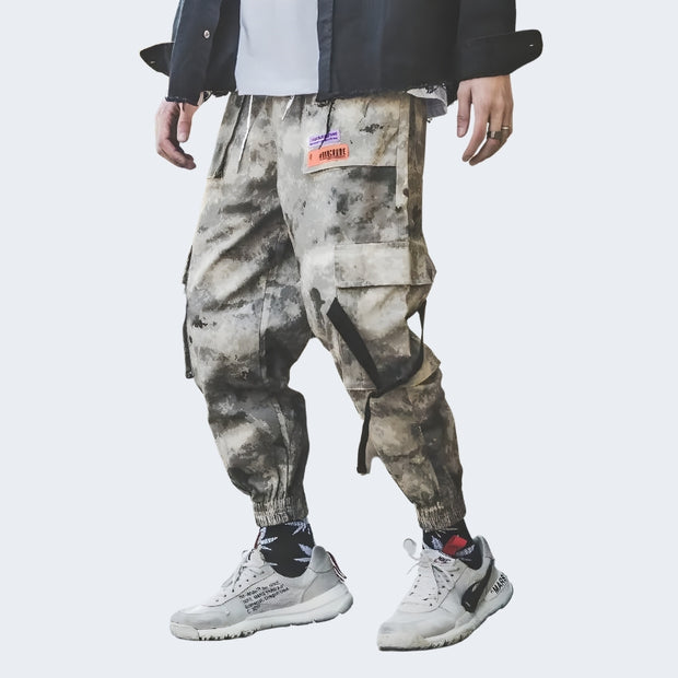 Drawstring closure techwear camo pants featuring camouflage print design