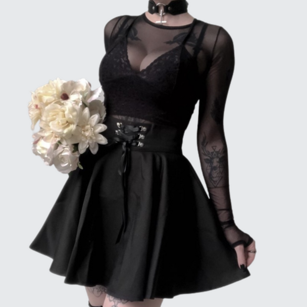 Women wearing black goth/emo girl style skirt
