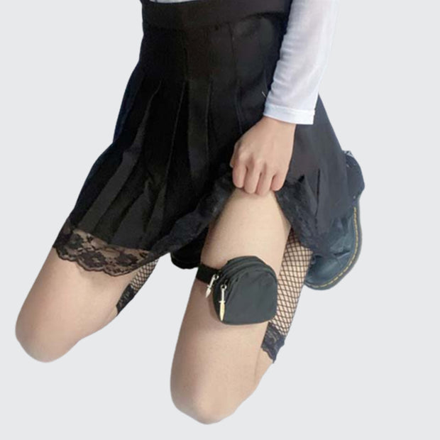 Women wearing black goth style leg bag