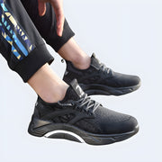 Techwear black high-soled trainers, futuristic streetwear sneakers, lightweight and trendy, available in the UK