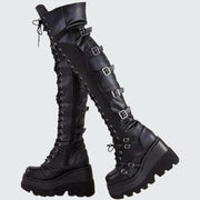 Women wearing black gothic boots hook & loop closure