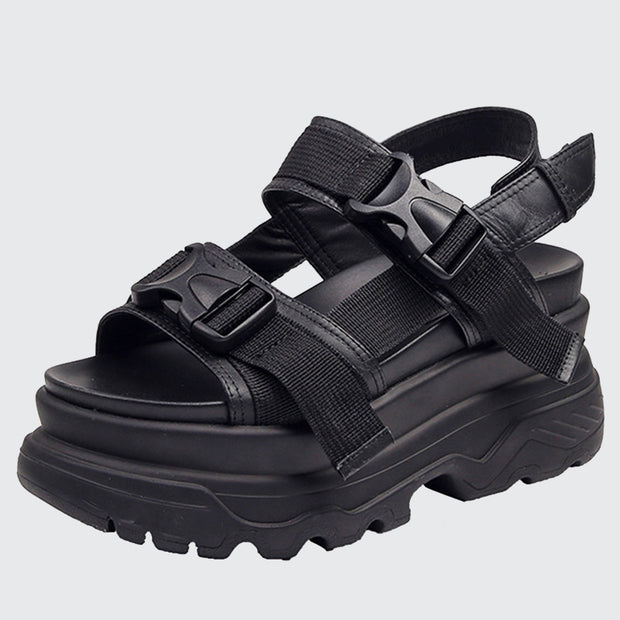 Women wearing black buckle closure sandals