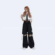 Women wearing black adjustable hollow trousers