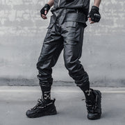 Man wearing black bybb waterproof techwear pants polyester