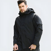 Man wearing black gorpcore rain jacket zipper closure