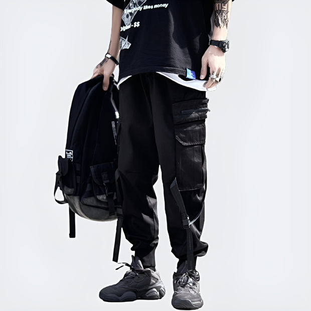 Man wearing black cargo pants with straps elastic waistband