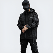 Man wearing black multi pocket anorak jacket zipper closure
