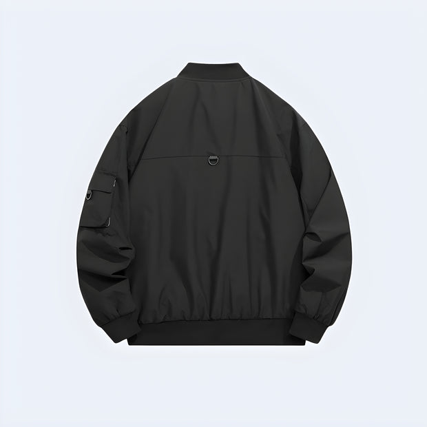 Man wearing black tactical bomber with pocket on front