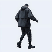 Techwear UK black cargo jacket with hood, back view, modern streetwear style.